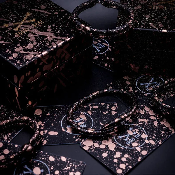 Matte Black Splashed Rose gold stingray bracelet studs