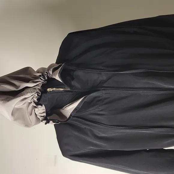 Outbrook  black and tan  hooded rain technical windbreaker jacket size small.
