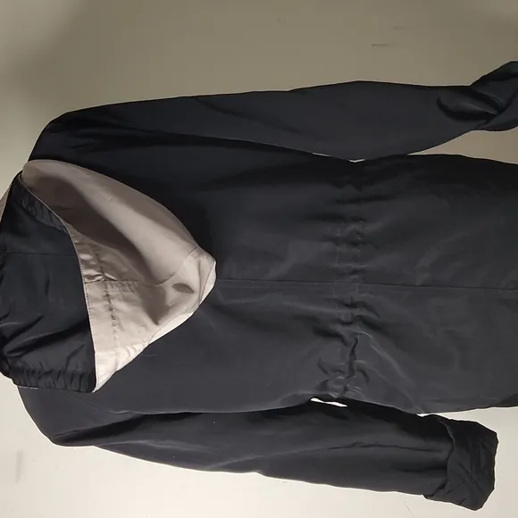 Outbrook  black and tan  hooded rain technical windbreaker jacket size small.